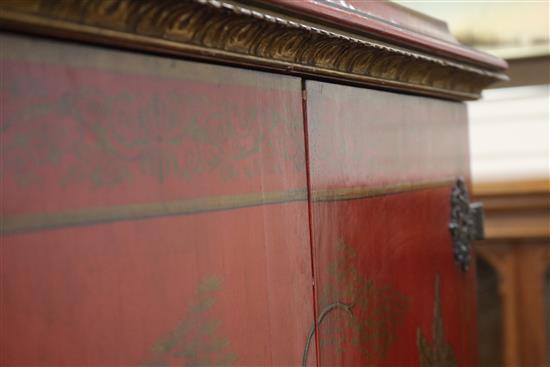 A red lacquer cocktail cabinet on stand, W.105cm